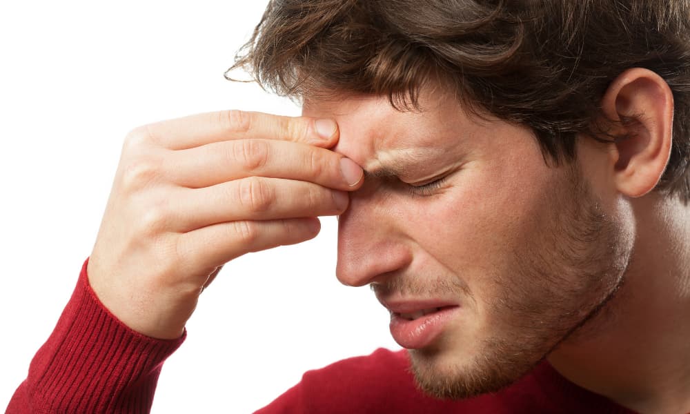 a man experiencing sinus trouble